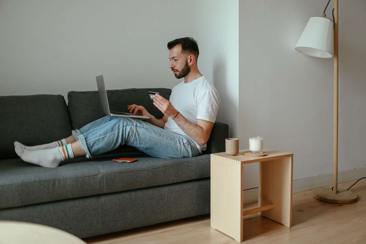 man buying online using credit card