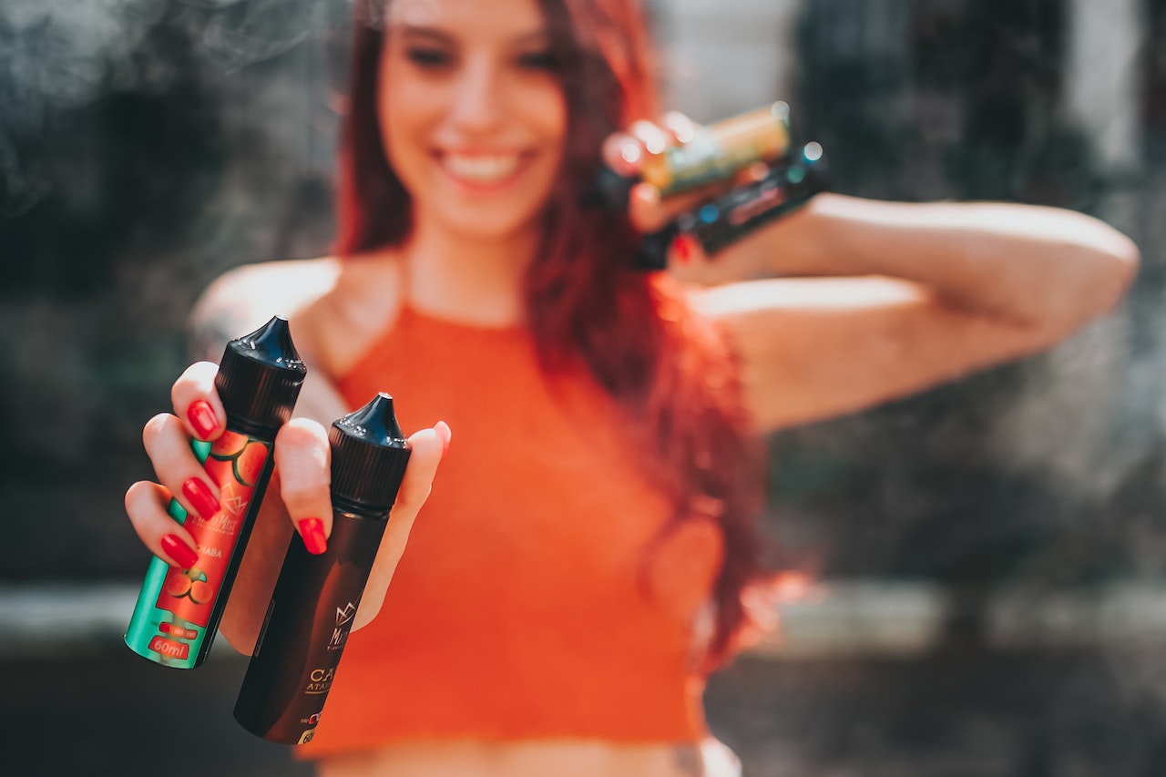 woman holding vape juice